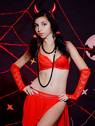 FreeKiloPics presents: Only one look in the eyes of this fantastic slim teen will tell that she is a little devil inside. No further costume is needed.